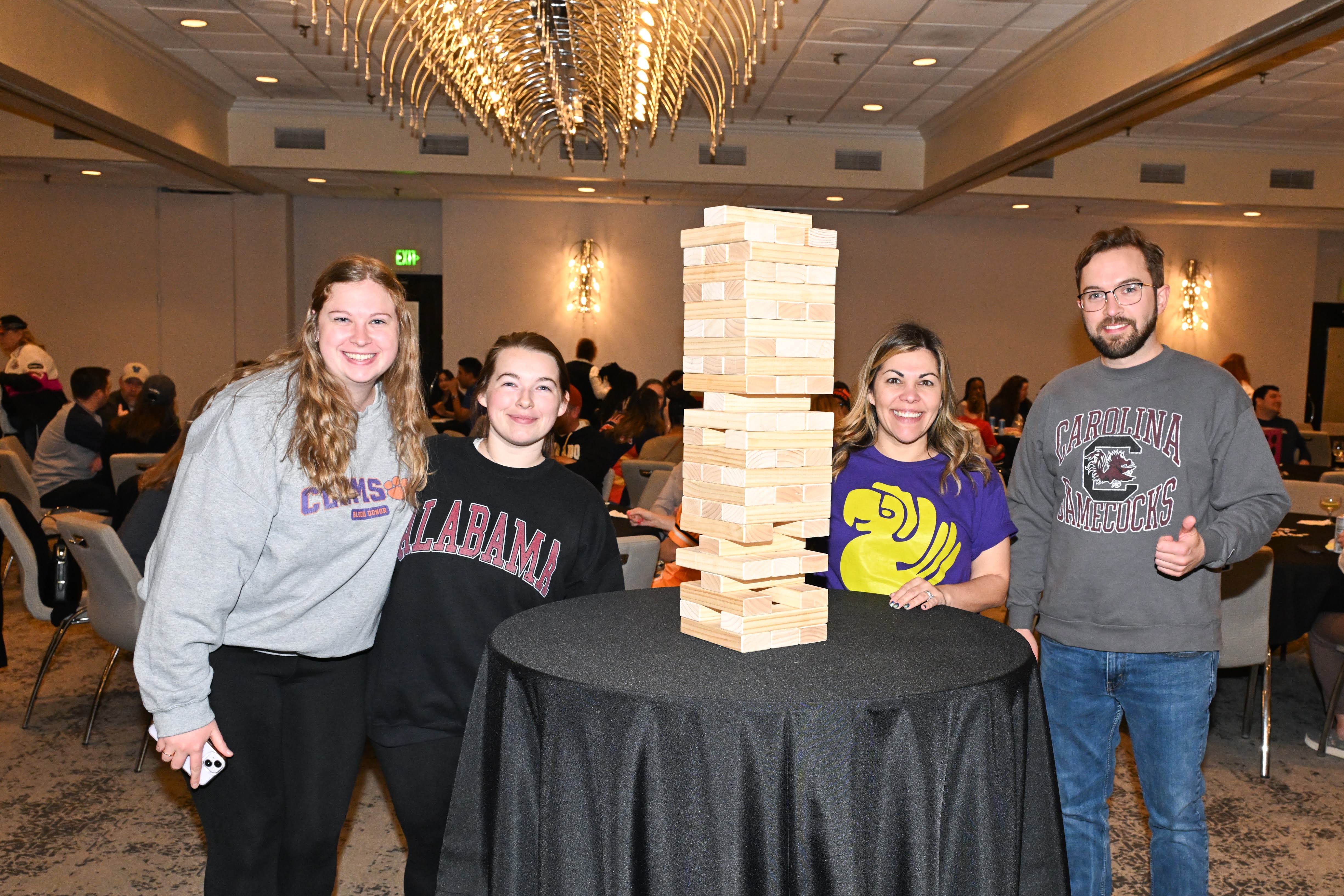 Elevate Audiology team building Jenga together
