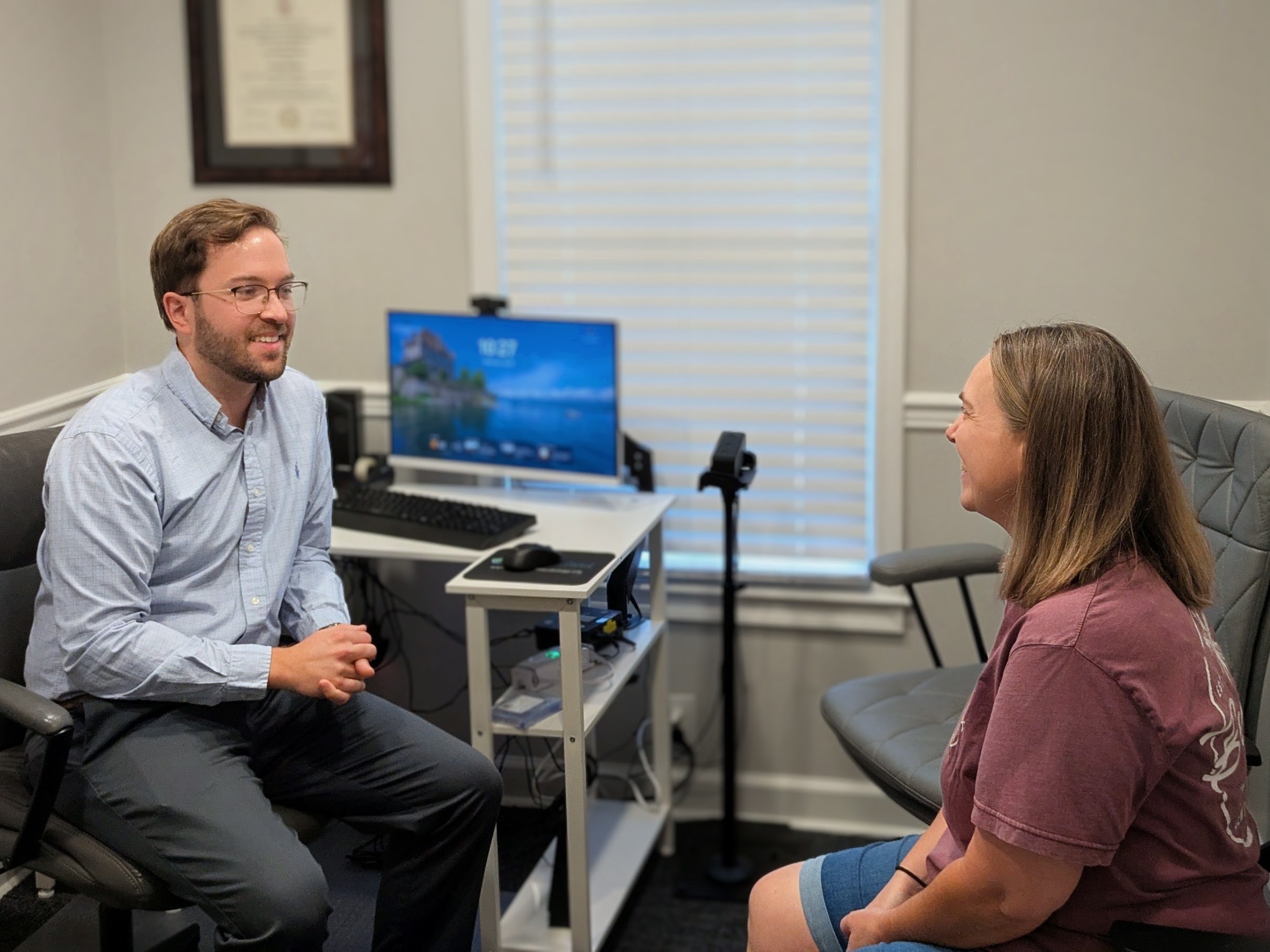 Audiologist with patient at Elevate Audiology