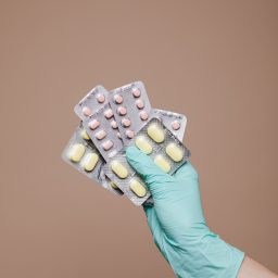 hand holding pack of medication